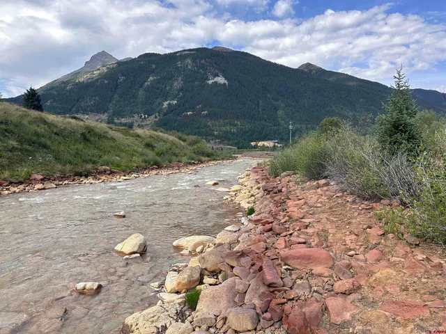 a view of a lake with mountains in the background