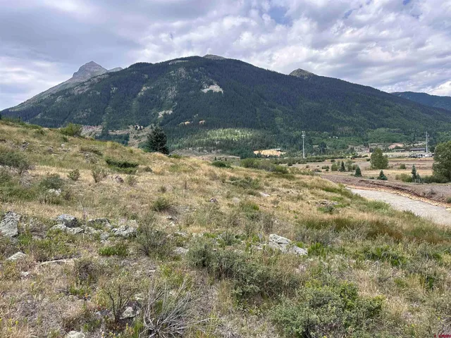 a view of a town with mountains in the background