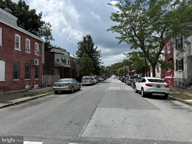 a view of street with parked cars