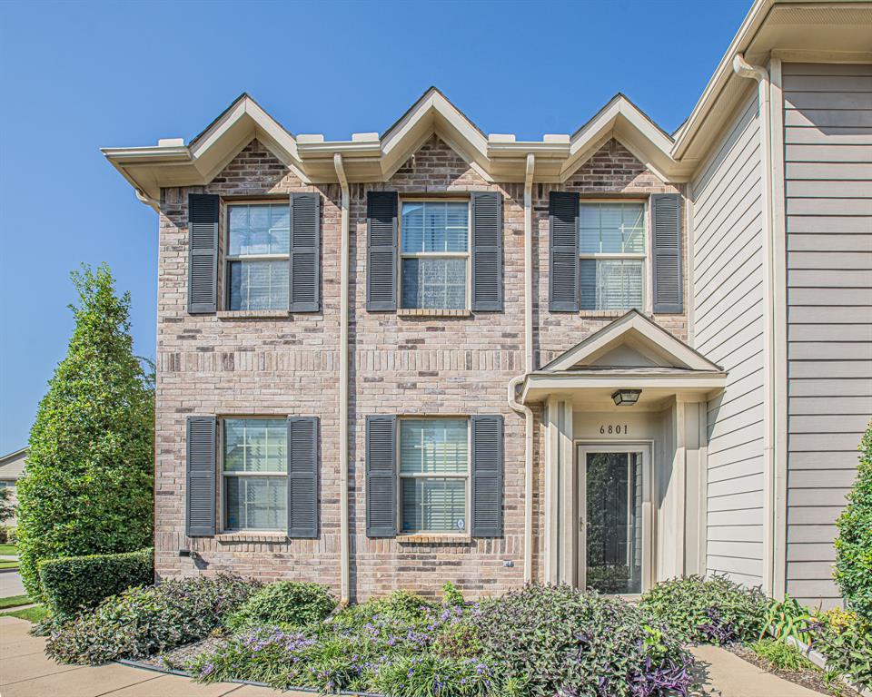 a front view of a house with garage