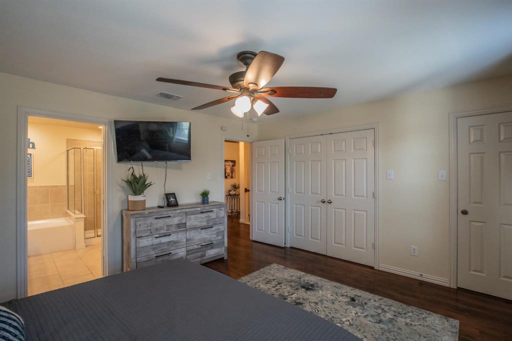 6801 Sandshell Boulevard Fort Worth, TX 76137 - Photo 13 of 28 a living room with furniture and a flat screen tv