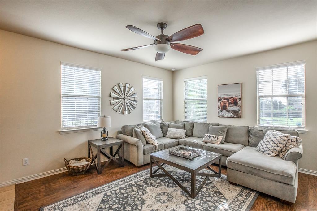 6801 Sandshell Boulevard Fort Worth, TX 76137 - Photo 3 of 28 a living room with furniture ceiling fan and a window