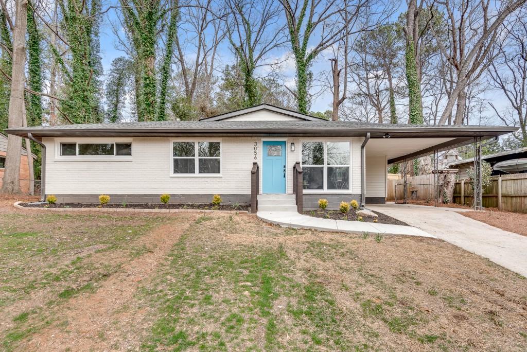 3056 Anthony Drive Decatur, GA 30033 - Photo 1 of 1 a house with trees in the background