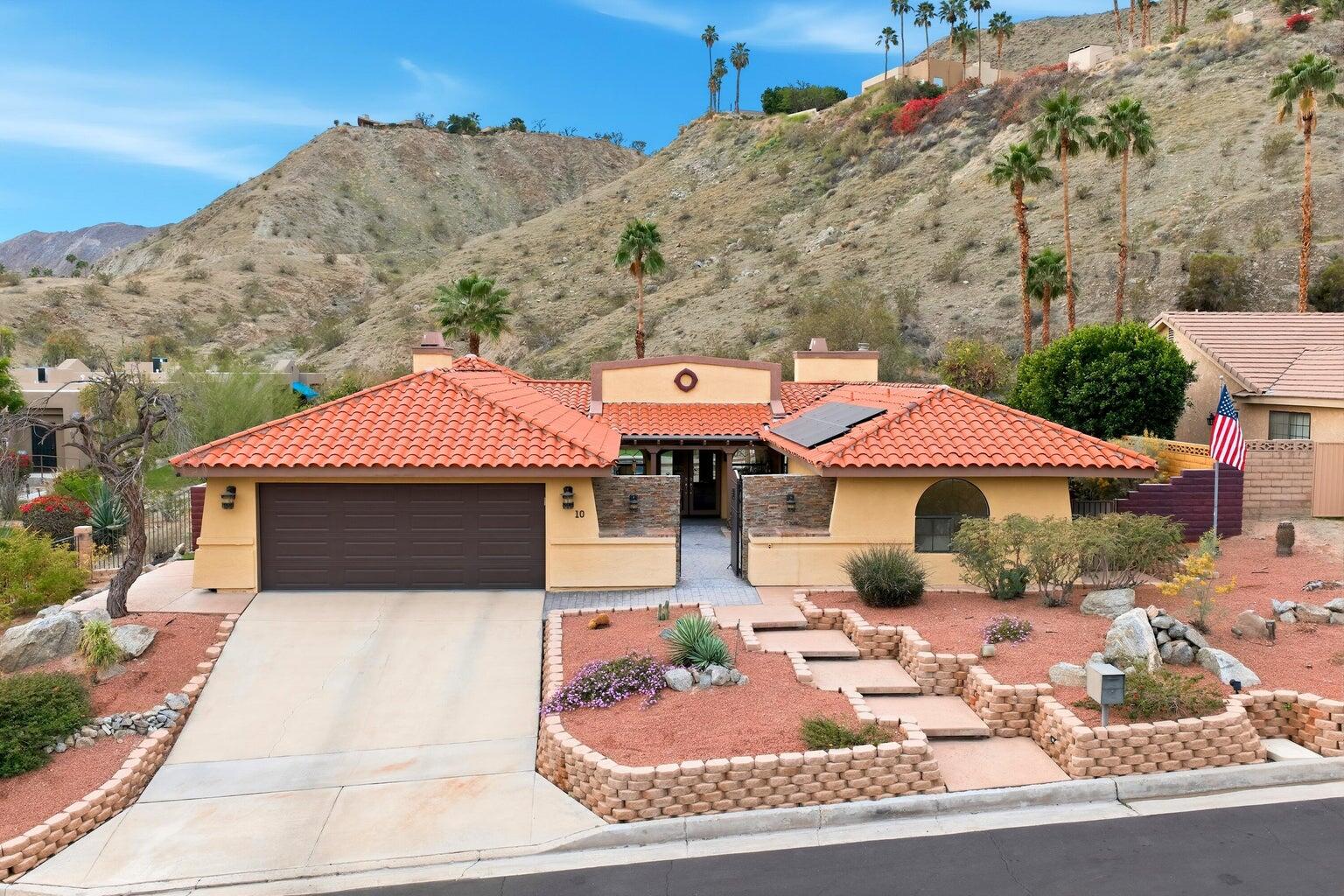 a front view of a house with yard