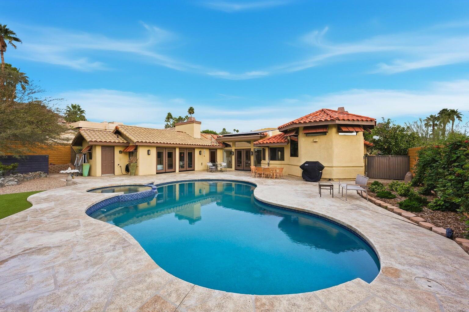 10 Venus Drive Rancho Mirage, CA 92270 - Photo 11 of 32 a view of a house with swimming pool