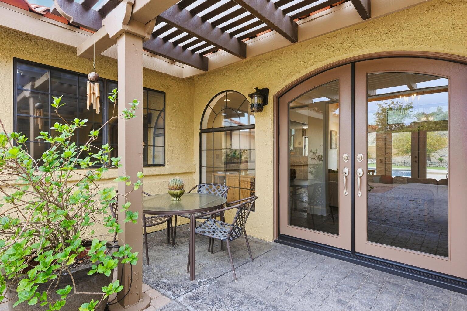 10 Venus Drive Rancho Mirage, CA 92270 - Photo 17 of 32 a view of a entryway door front of house