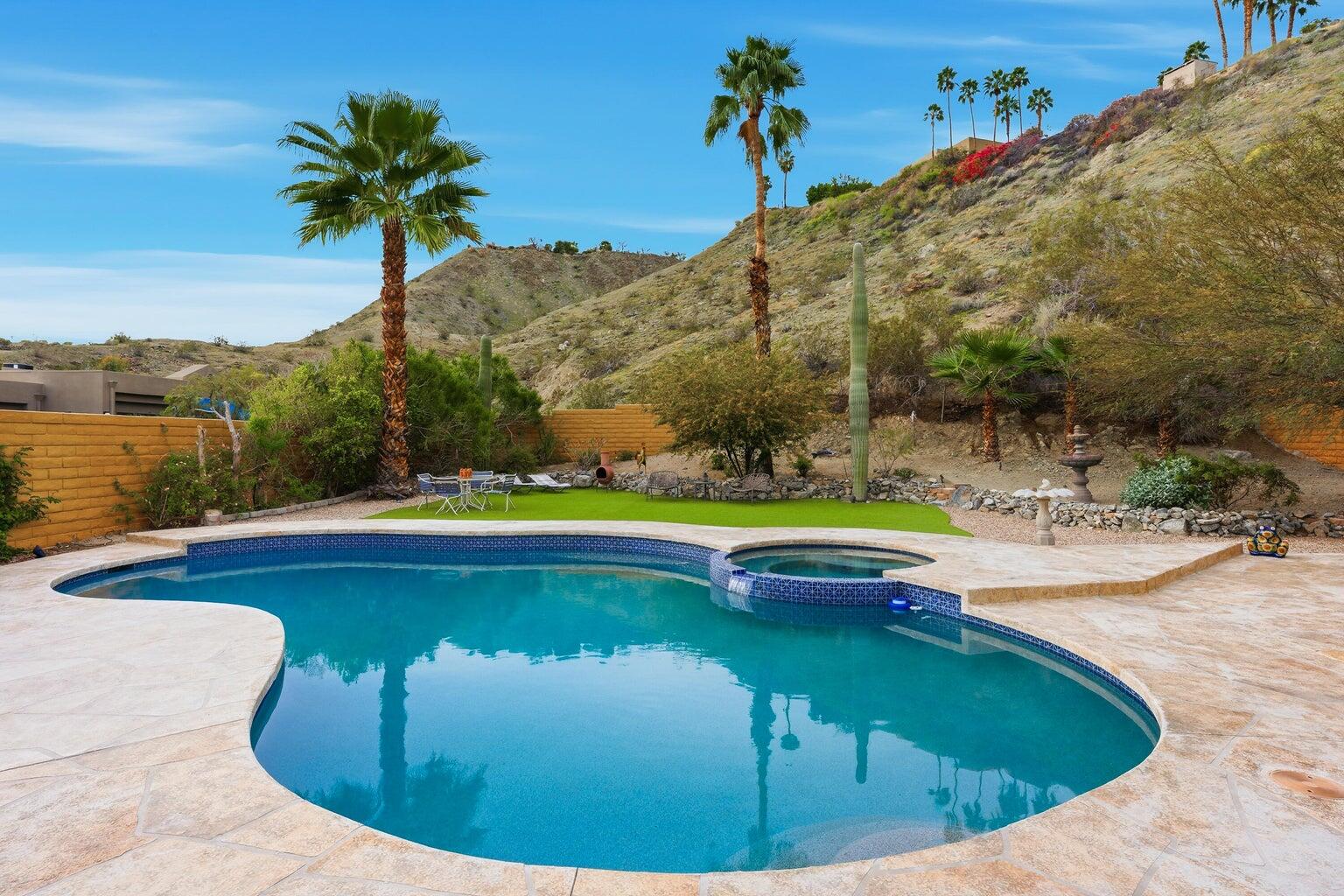 10 Venus Drive Rancho Mirage, CA 92270 - Photo 2 of 32 a view of a swimming pool with a yard and mountain view