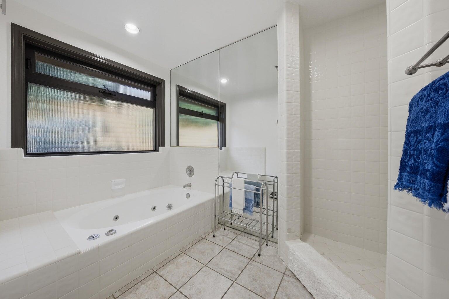 10 Venus Drive Rancho Mirage, CA 92270 - Photo 24 of 32 a bathroom with a bathtub and a shower