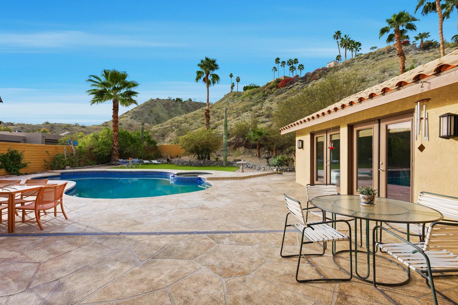 10 Venus Drive Rancho Mirage, CA 92270 - Photo 7 of 32 a view of a house with swimming pool and a porch