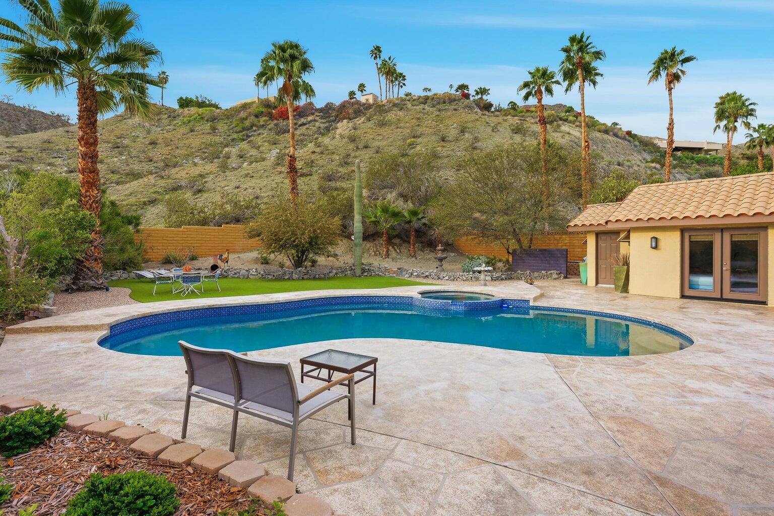 10 Venus Drive Rancho Mirage, CA 92270 - Photo 10 of 32 a view of a swimming pool with a yard