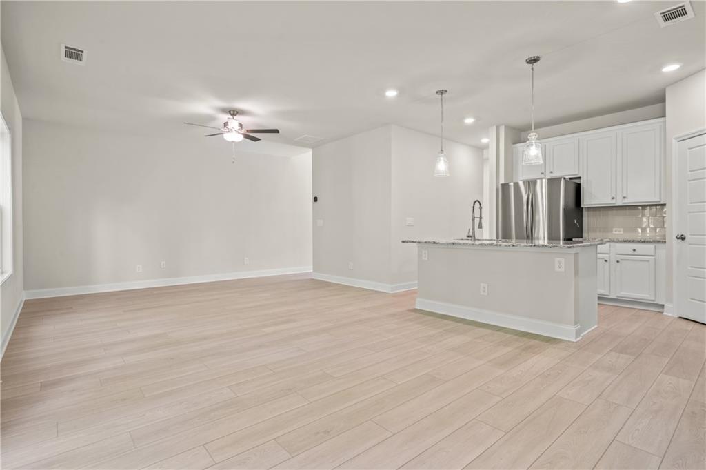 32 Station Overlook Way Auburn, GA 30011 - Photo 11 of 38 a view of a kitchen with a sink and a refrigerator