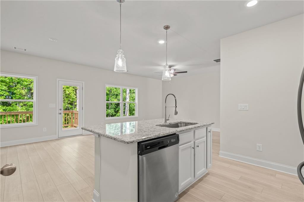 32 Station Overlook Way Auburn, GA 30011 - Photo 16 of 38 a kitchen with a sink cabinets and window