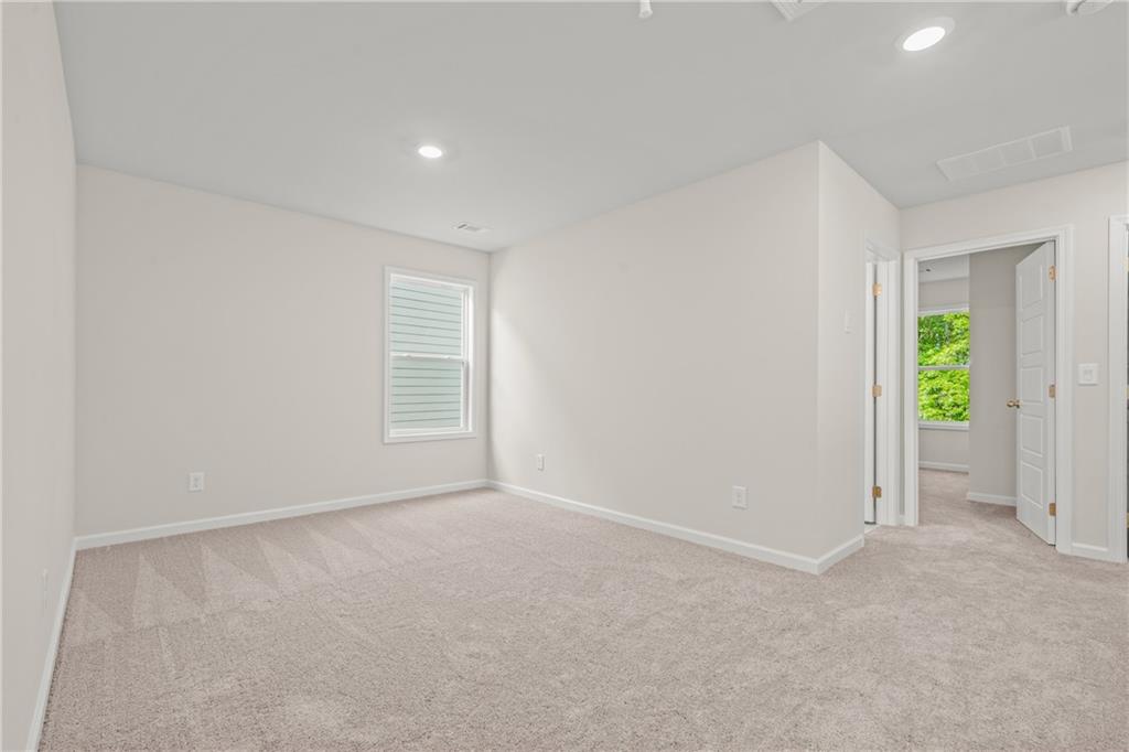 32 Station Overlook Way Auburn, GA 30011 - Photo 20 of 38 an empty room with window and stairs