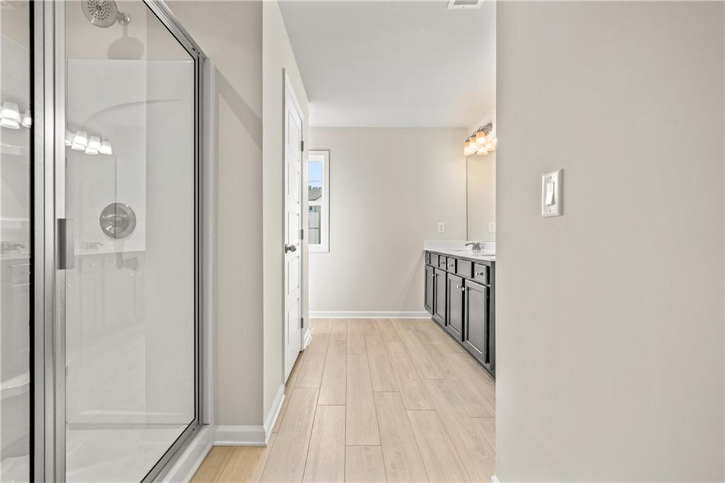 32 Station Overlook Way Auburn, GA 30011 - Photo 27 of 38 a view of hallway with wooden floor