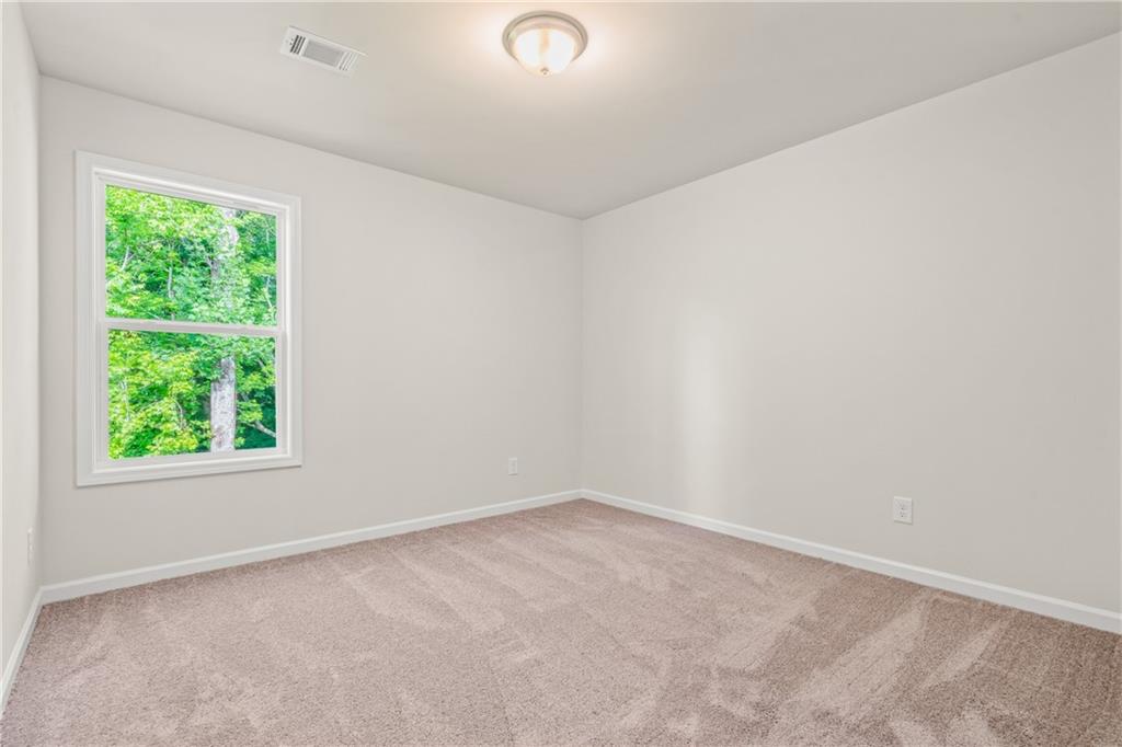 32 Station Overlook Way Auburn, GA 30011 - Photo 33 of 38 an empty room with a window