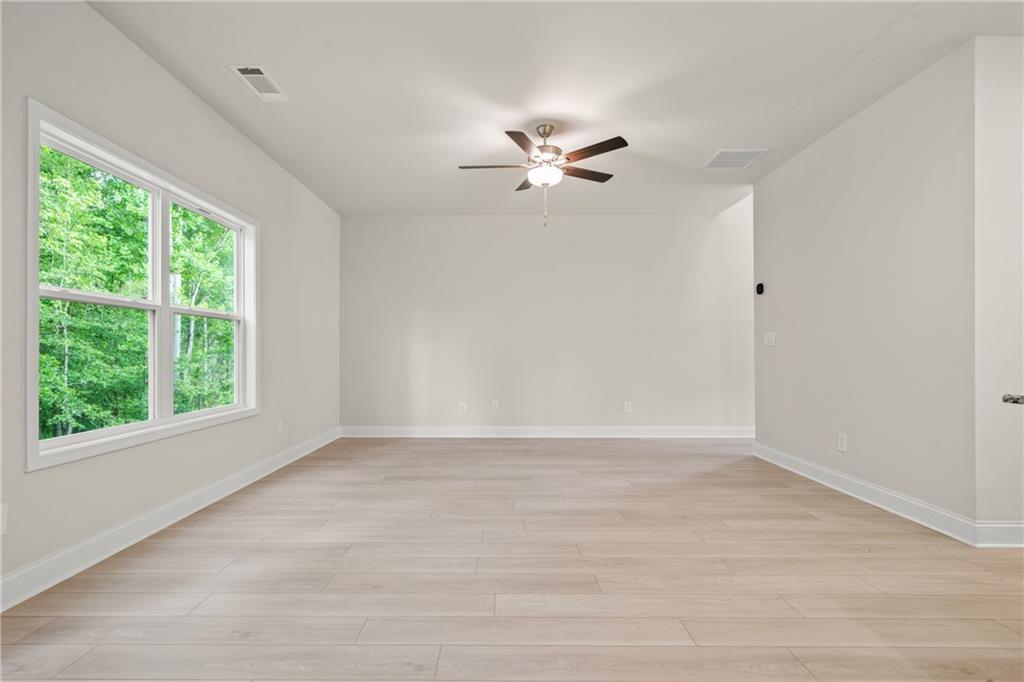 32 Station Overlook Way Auburn, GA 30011 - Photo 7 of 38 a view of an empty room with a window