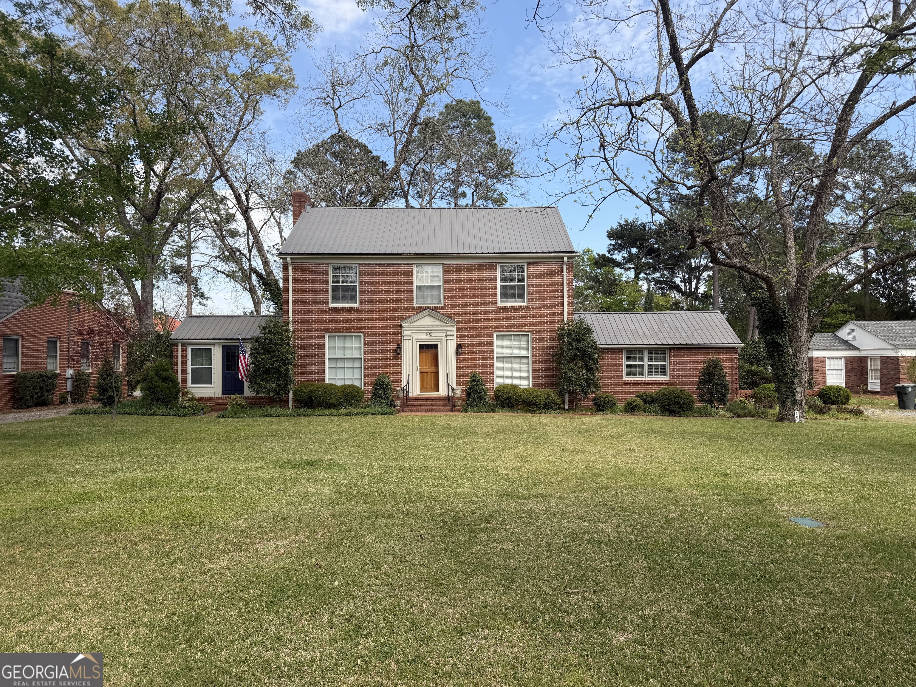 a view of a big yard with a house