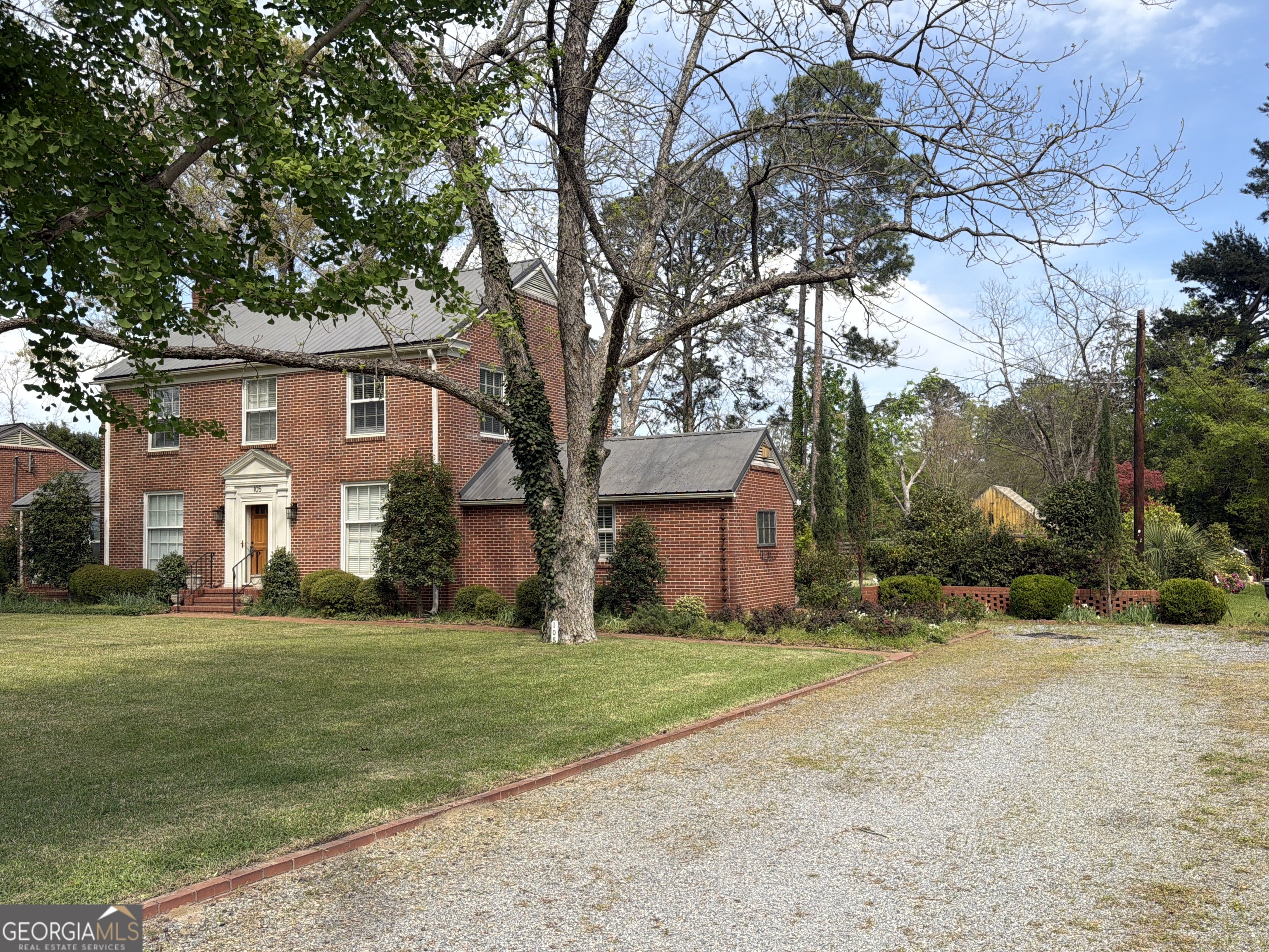 105 Lacross Street Dublin, GA 31021 - Photo 68 of 68 a front view of house with yard and green space