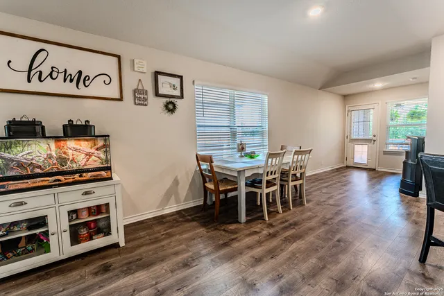 a view of a dining room with furniture window and wooden floor