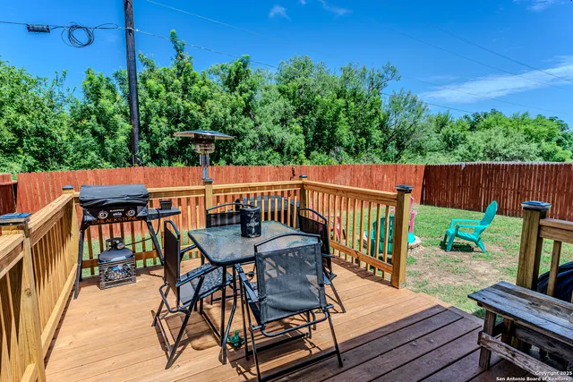 a view of a chairs and table on the deck