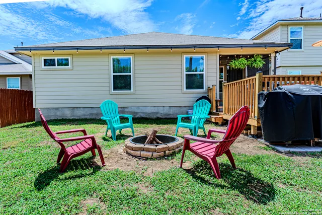 a backyard of a house with seating space