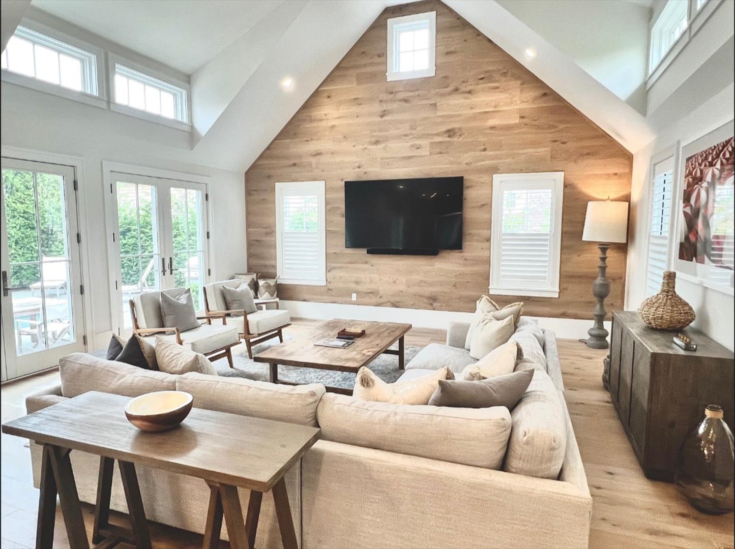 9 A Pilgrim Road Nantucket, MA 02554 - Photo 14 of 34 a living room with furniture flat screen tv and a large window