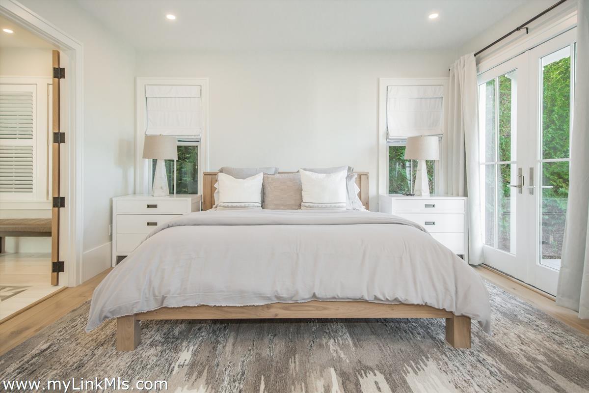 9 A Pilgrim Road Nantucket, MA 02554 - Photo 18 of 34 a bedroom with a bed and a large window