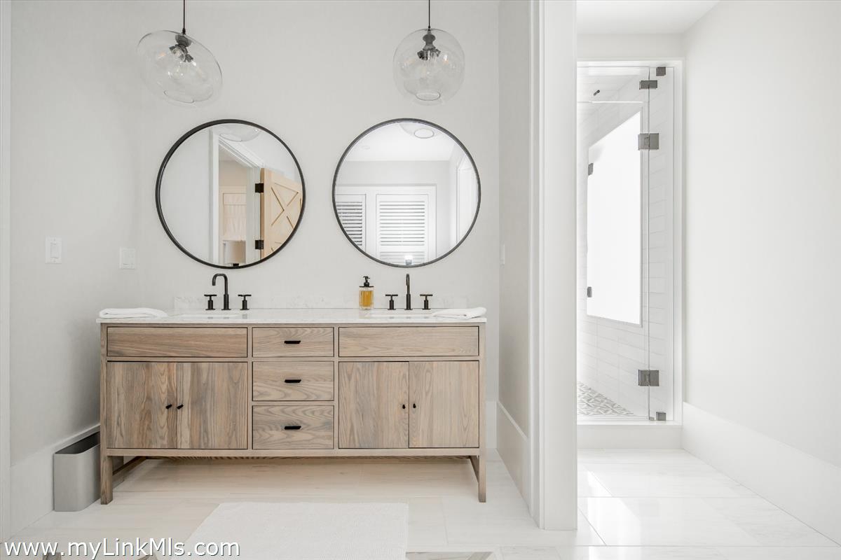 9 A Pilgrim Road Nantucket, MA 02554 - Photo 20 of 34 a bathroom with a double vanity sink and a mirror