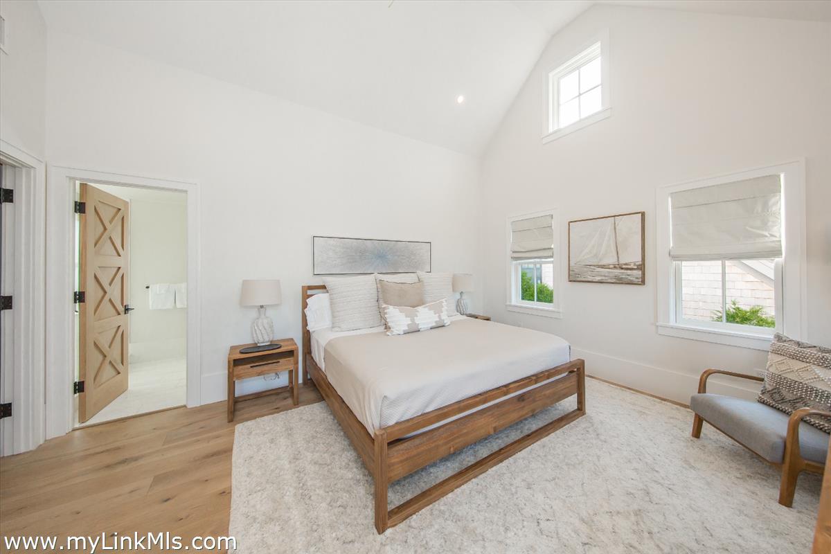 9 A Pilgrim Road Nantucket, MA 02554 - Photo 22 of 34 a bedroom with a bed and a couch