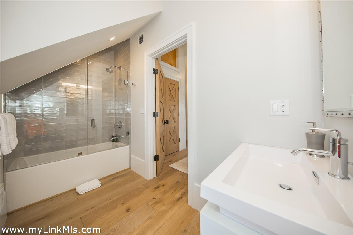9 A Pilgrim Road Nantucket, MA 02554 - Photo 25 of 34 a bathroom with a bathtub and a sink