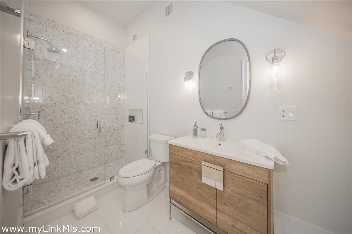 9 A Pilgrim Road Nantucket, MA 02554 - Photo 31 of 34 a bathroom with a sink toilet and shower
