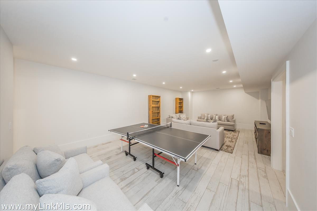 9 A Pilgrim Road Nantucket, MA 02554 - Photo 32 of 34 a living room with furniture and wooden floor