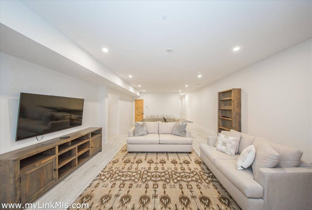 9 A Pilgrim Road Nantucket, MA 02554 - Photo 33 of 34 a living room with furniture and a flat screen tv