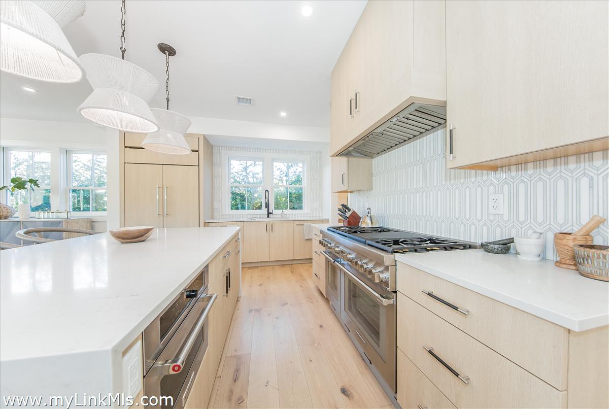 9 A Pilgrim Road Nantucket, MA 02554 - Photo 9 of 34 a kitchen with a stove and a view of living room
