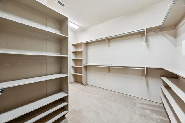 a view of an empty walk in closet