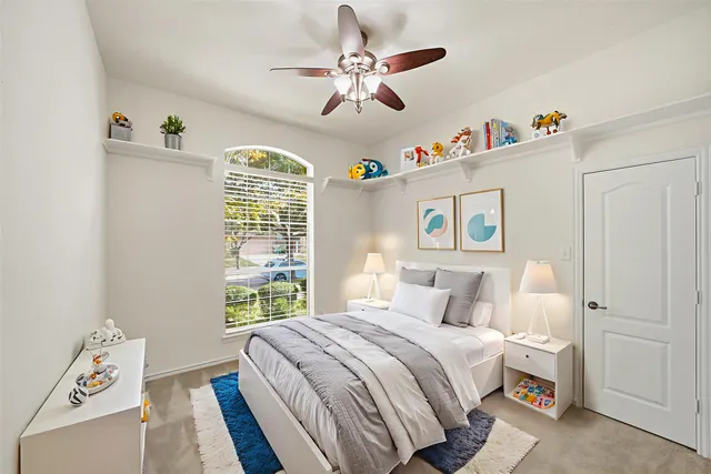 a bedroom with a bed and a window