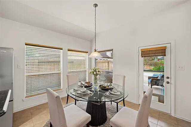 a view of a room with furniture and windows