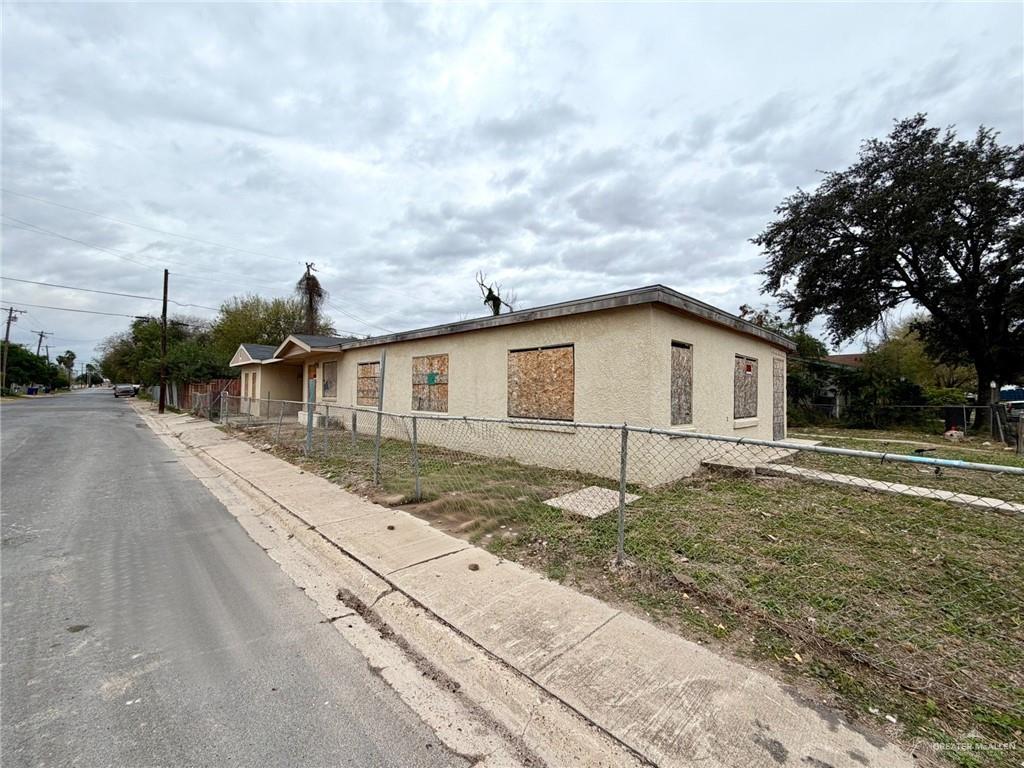 1101 North 19th Street McAllen, TX 78501 - Photo 4 of 7 a view of a house with backyard and trees