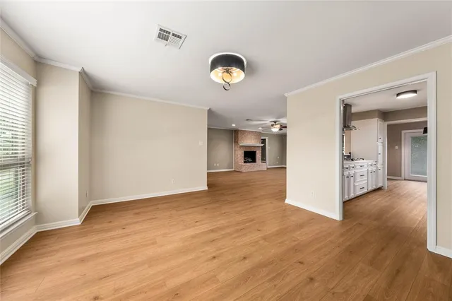 a large kitchen with cabinets and stainless steel appliances