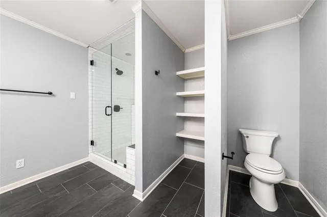 a view of a bathroom from a hallway