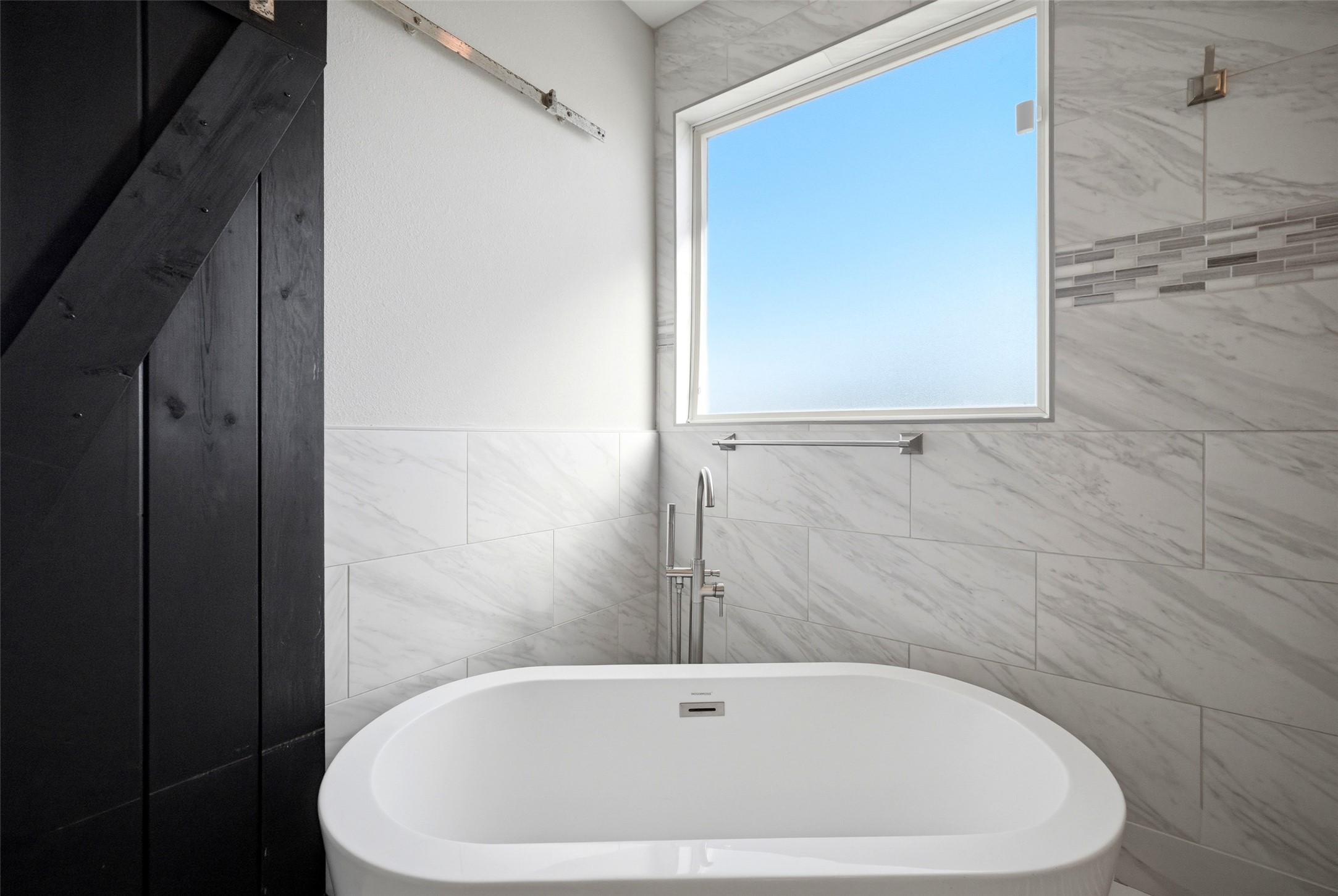 605 Dumble Street Houston, TX 77023 - Photo 28 of 44 a white bath tub sitting in a bathroom