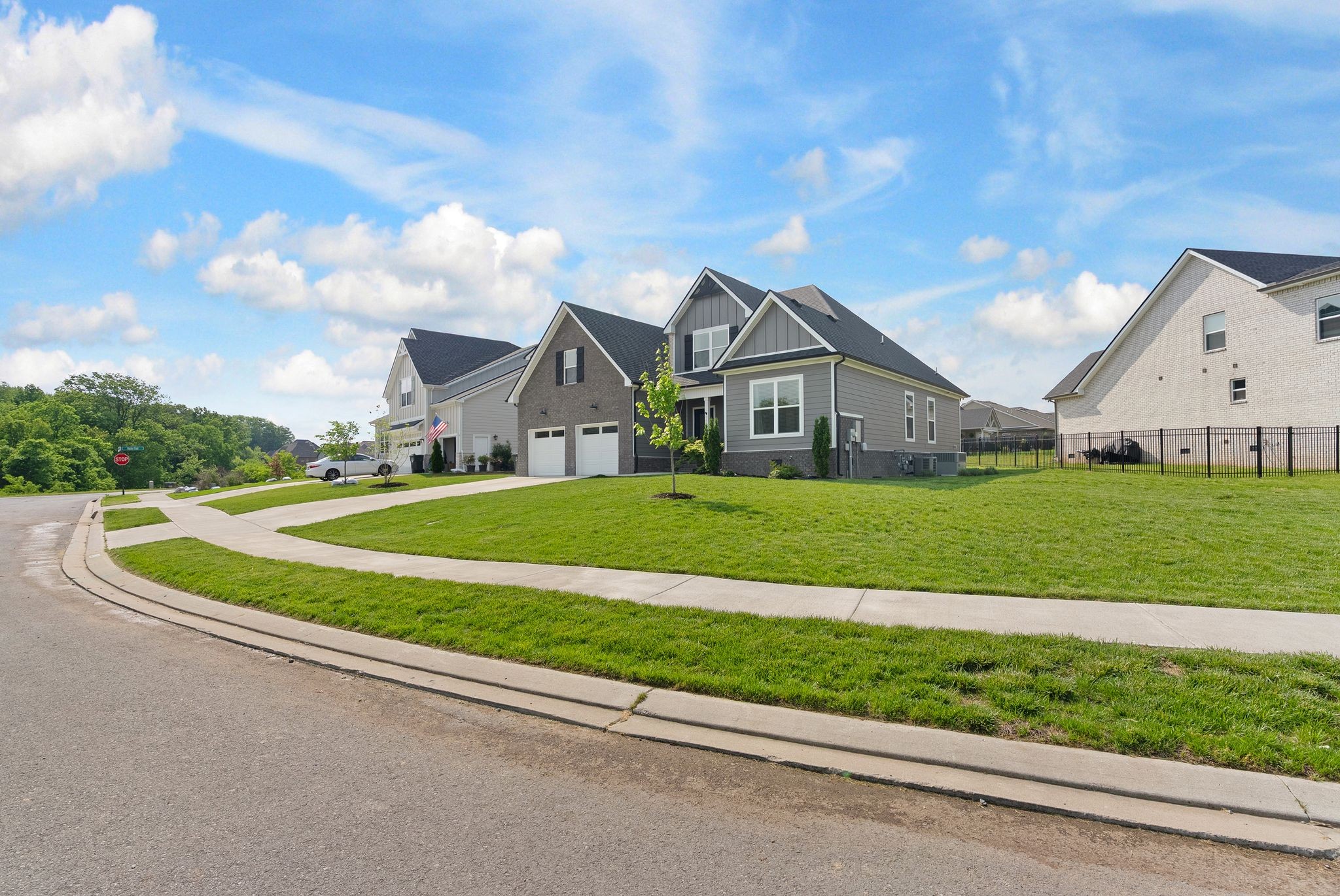 503 Smokey Ridge La Vergne, TN 37086 - Photo 2 of 38 a view of an house with a big yard potted plants and large tree