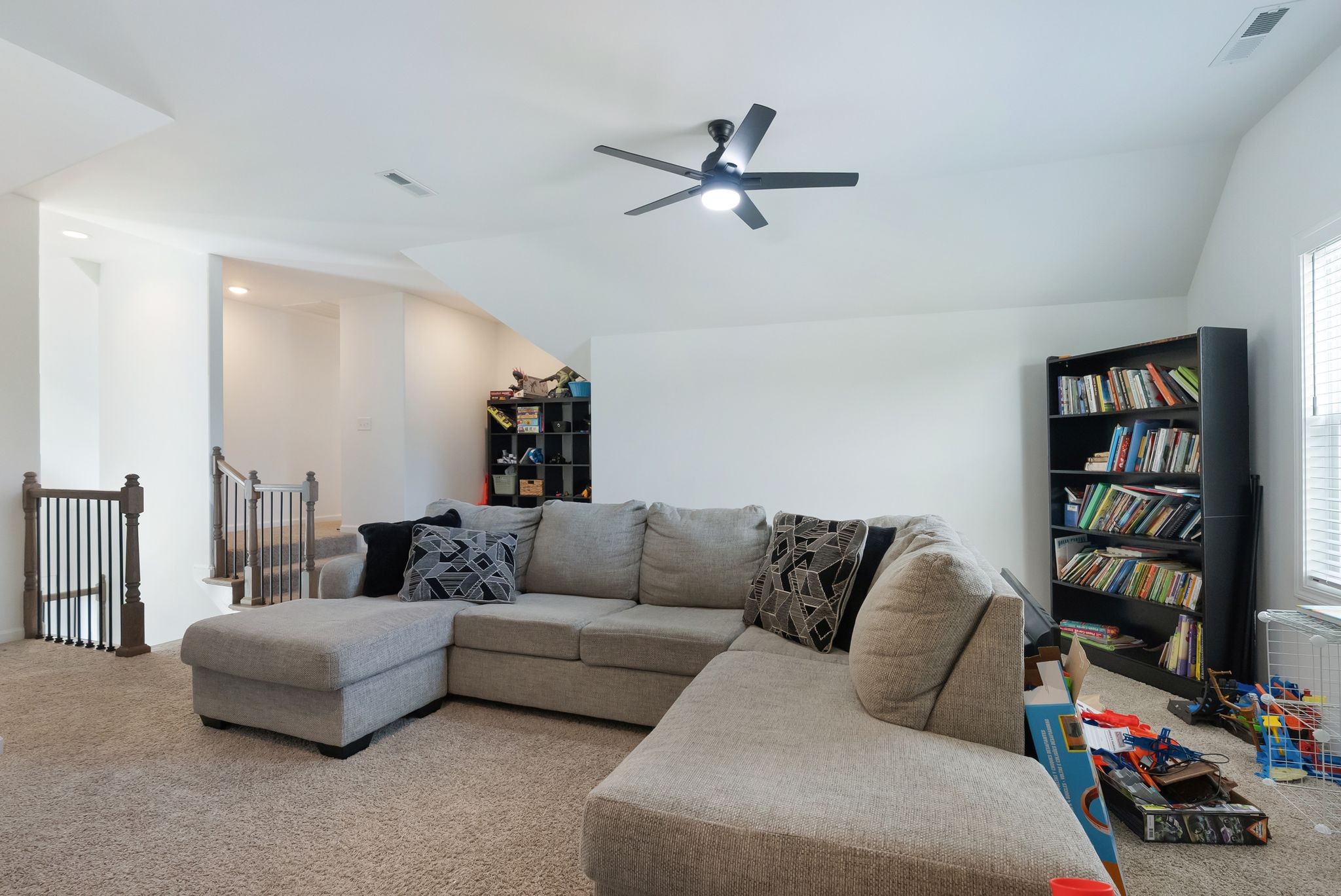 503 Smokey Ridge La Vergne, TN 37086 - Photo 26 of 38 a living room with furniture and a book shelf
