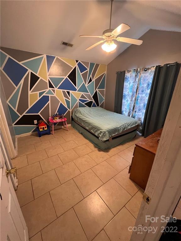 1143 Hannah Rae Court Charlotte, NC 28214 - Photo 18 of 21 a living room with blue lights with furniture and a chandelier