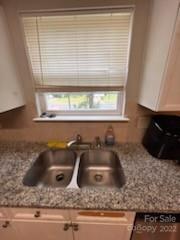 1143 Hannah Rae Court Charlotte, NC 28214 - Photo 21 of 21 a kitchen with a sink and a window
