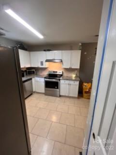 1143 Hannah Rae Court Charlotte, NC 28214 - Photo 3 of 21 a kitchen with granite countertop a refrigerator and a sink