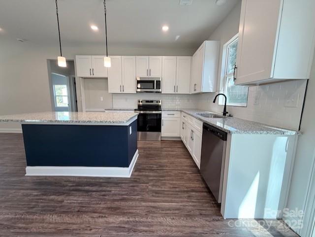 212 Queens Court Gastonia, NC 28052 - Photo 13 of 42 a large kitchen with stainless steel appliances granite countertop a sink a stove and a wooden floors