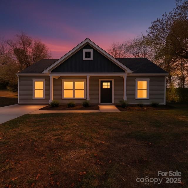 212 Queens Court Gastonia, NC 28052 - Photo 2 of 42 a front view of a house with a yard