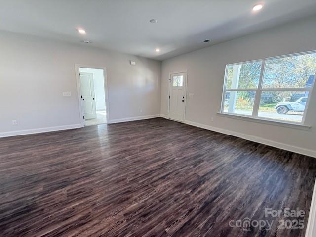 212 Queens Court Gastonia, NC 28052 - Photo 9 of 42 an empty room with wooden floor and windows
