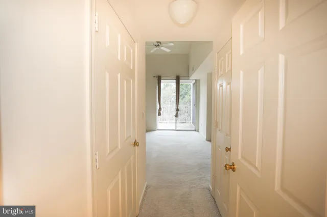 an empty room with windows and entrance